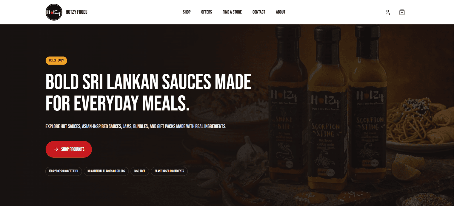 Hotzy Foods homepage hero with sauce bottles, navigation, and product discovery call to action.